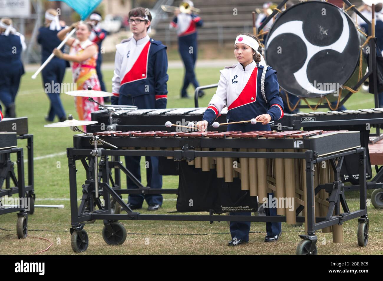 asian-american-teenage-girl-plays-the-marimba-in-a-high-school-marching-band-competition-2BBJBC5.jpg