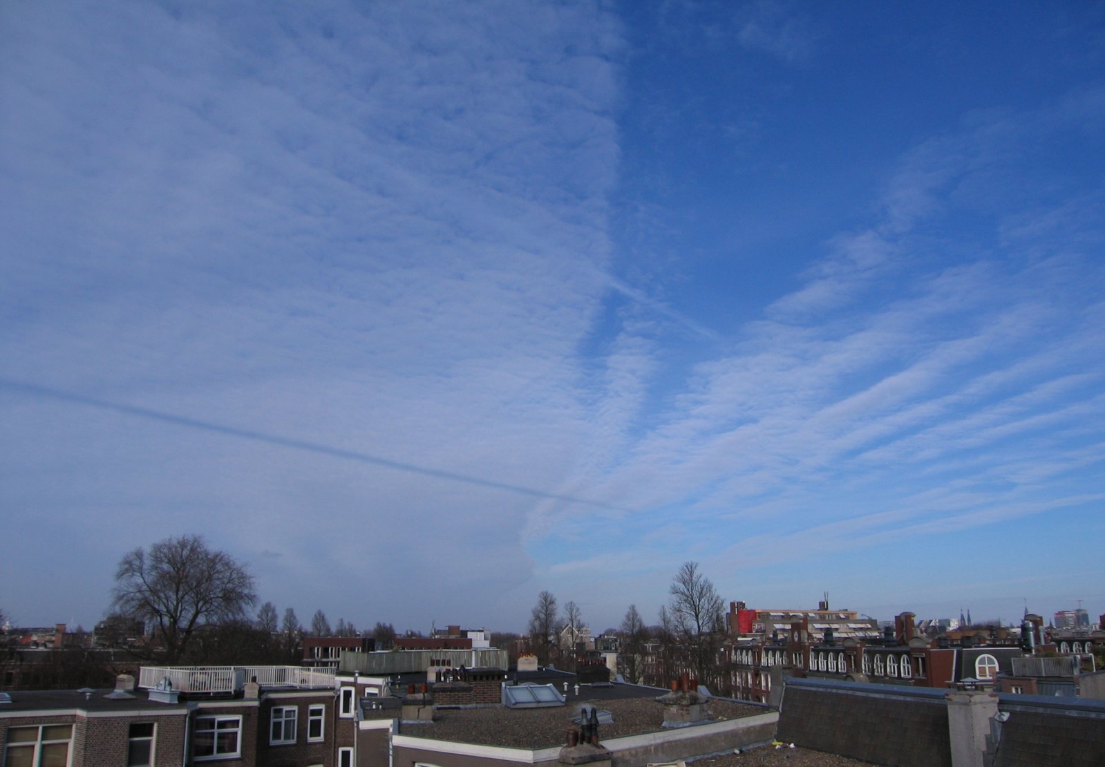 Cloud front and shadow contrail.jpg