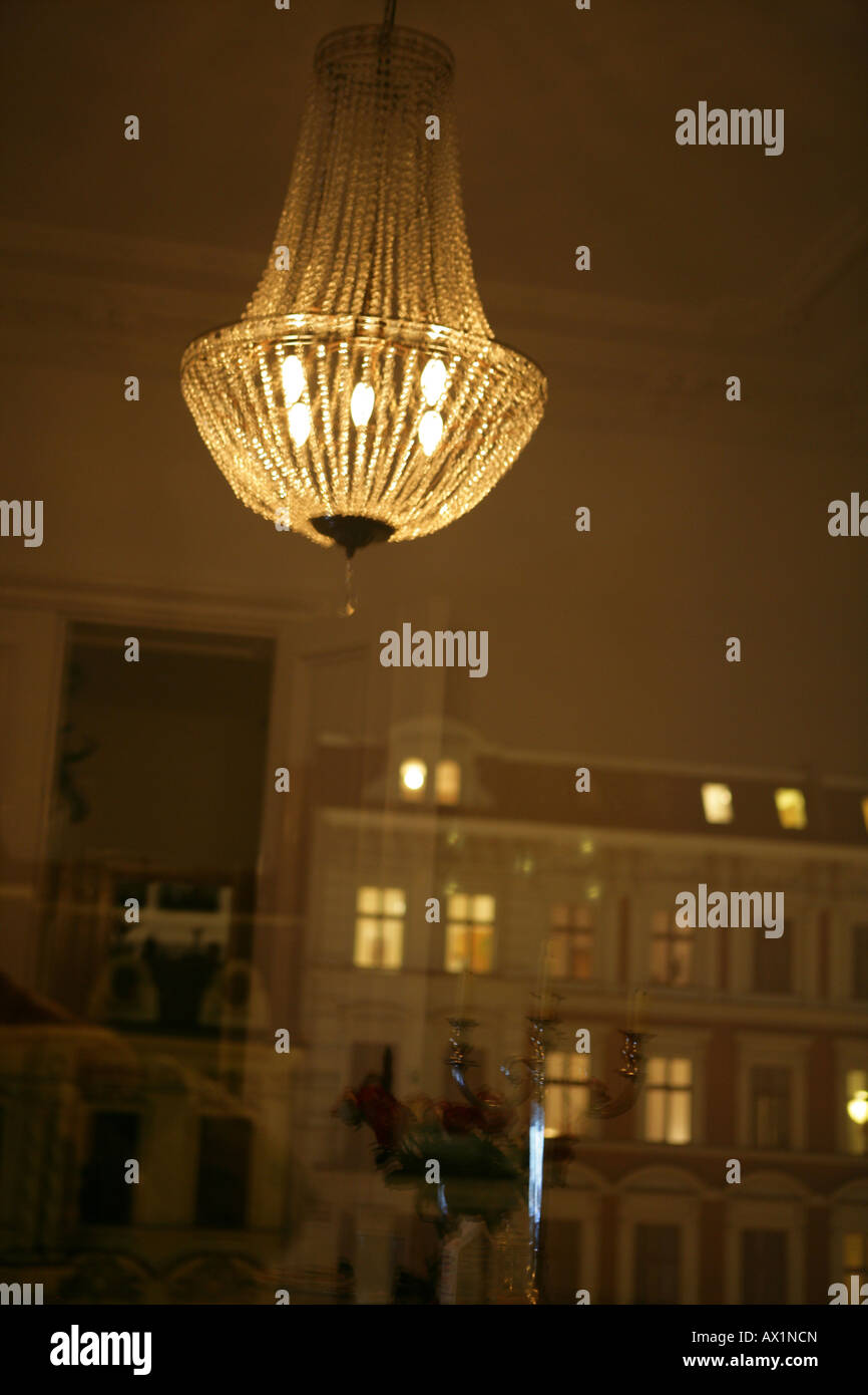 reflection-on-a-chandelier-in-the-window-during-the-night-AX1NCN.jpg