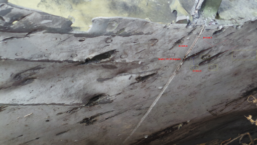 Akkermans-close up fragment damage top cockpit-angle.PNG